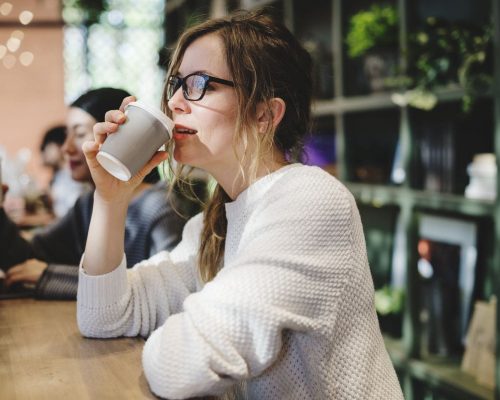 Blond woman having a cup of coffee